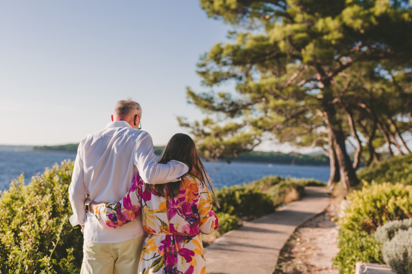 Couple walking near the sea in campsite Čikat