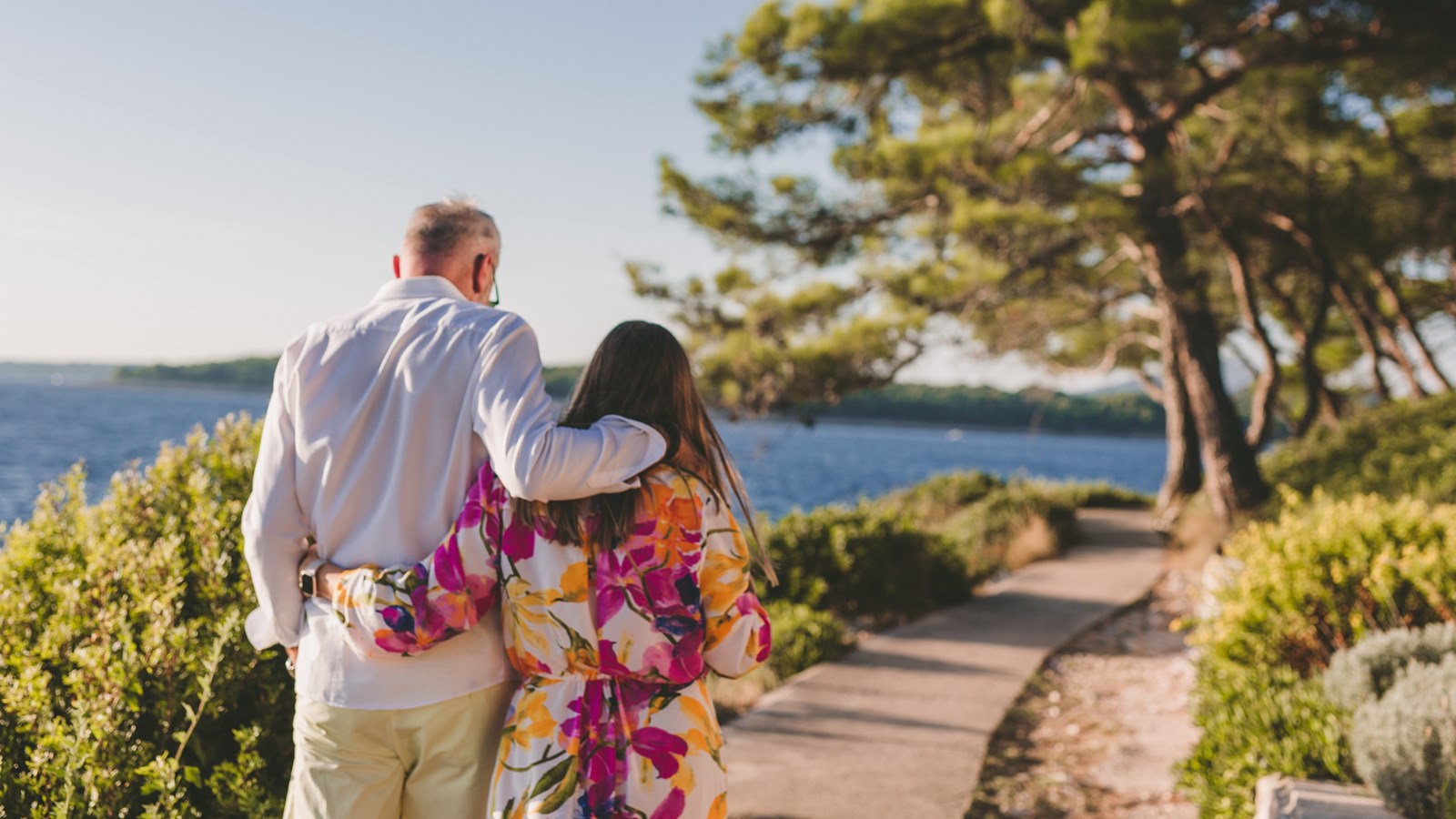 Couple walking by the sea